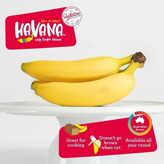 Havana Lady Finger bananas on a cake stand, labelled great for cooking, does not go brown when cut and available all year round